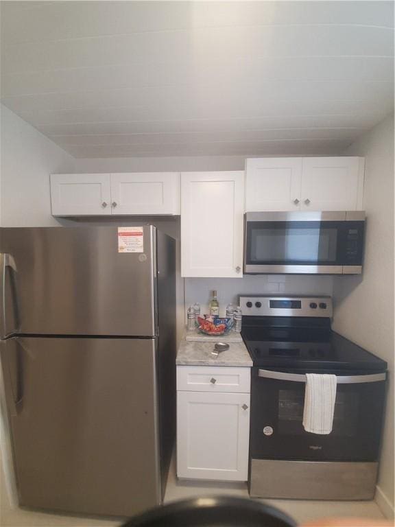 kitchen featuring white cabinetry and stainless steel appliances