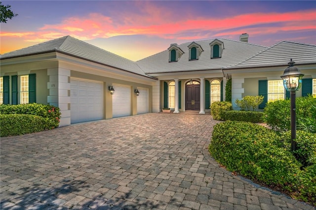 view of front of property featuring a garage