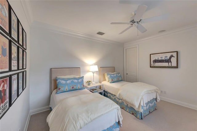 carpeted bedroom featuring ornamental molding and ceiling fan