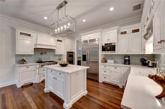 kitchen with white cabinetry and appliances with stainless steel finishes