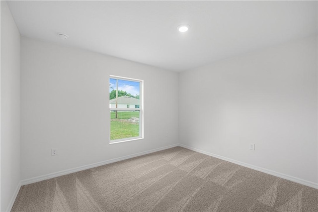 7860 97th Ave, Vero Beach, FL 32967 - empty room with carpet, baseboards, and recessed lighting