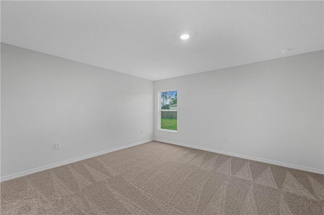 7860 97th Ave, Vero Beach, FL 32967 - empty room with baseboards, carpet, and recessed lighting