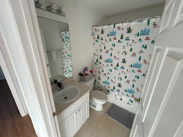 full bathroom with shower / bath combo, vanity, and toilet