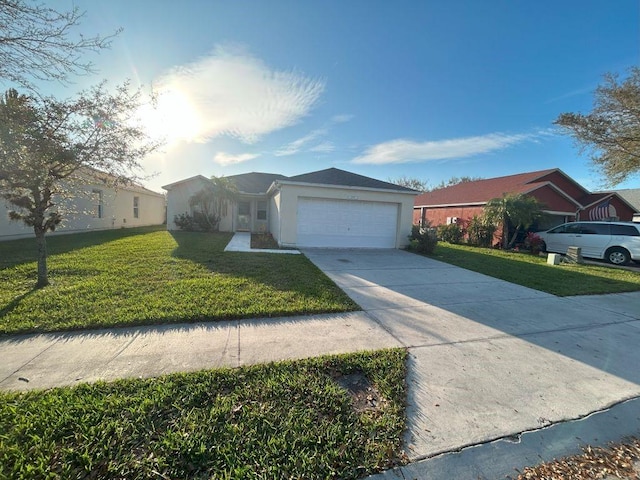 ranch-style home with an attached garage, a front lawn, concrete driveway, and stucco siding