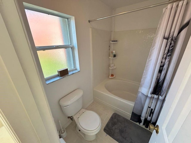 full bathroom with toilet, tile patterned flooring, and shower / bath combo