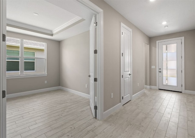 1251 Haven Unit Prestige 37, Vero Beach, FL 32960 - foyer entrance featuring light wood-style floors, baseboards, and a raised ceiling