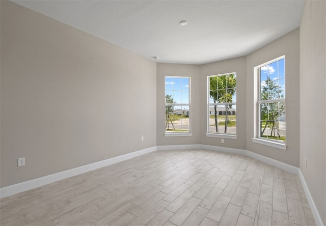 1251 Haven Unit Prestige 37, Vero Beach, FL 32960 - spare room with light wood finished floors and baseboards
