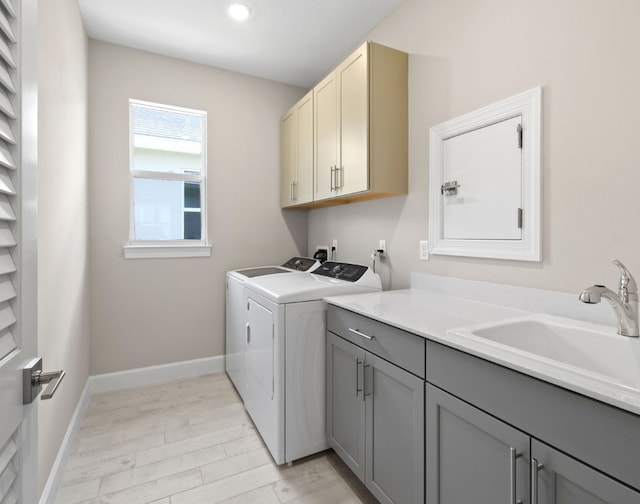 1251 Haven Unit Prestige 37, Vero Beach, FL 32960 - laundry area featuring cabinet space, washing machine and clothes dryer, light wood-style floors, baseboards, and recessed lighting