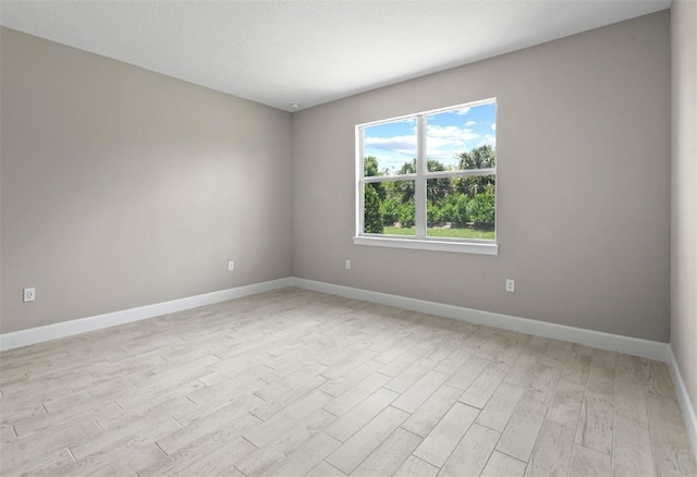 1251 Haven Unit Prestige 37, Vero Beach, FL 32960 - spare room featuring light wood-style floors and baseboards