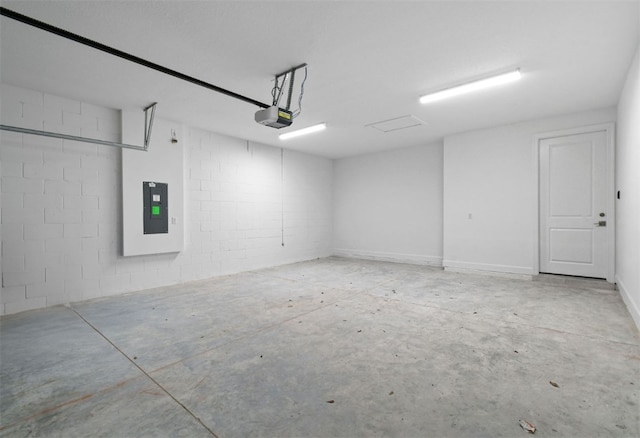 1251 Haven Unit Prestige 37, Vero Beach, FL 32960 - garage featuring a garage door opener, electric panel, and concrete block wall