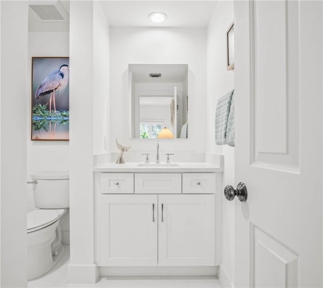 bathroom with vanity and toilet