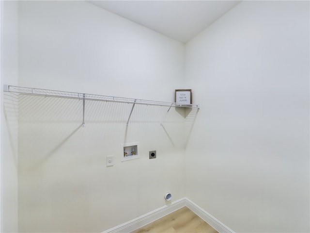 washroom featuring washer hookup, electric dryer hookup, and hardwood / wood-style flooring