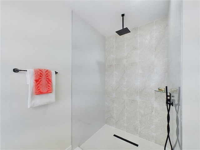 bathroom with a tile shower