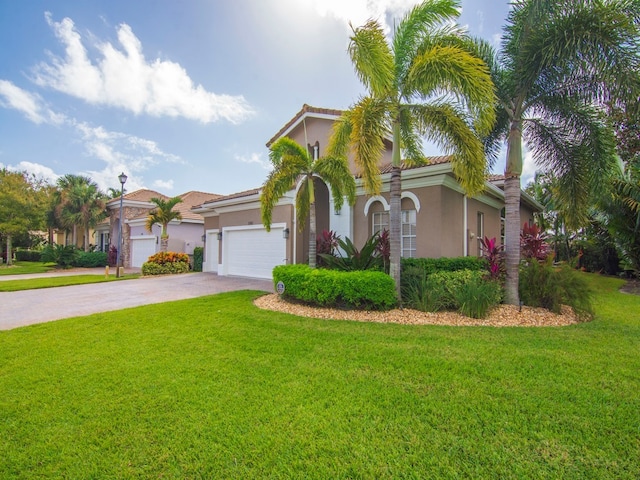 mediterranean / spanish-style house featuring a front yard