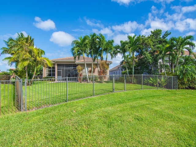 view of yard with a sunroom