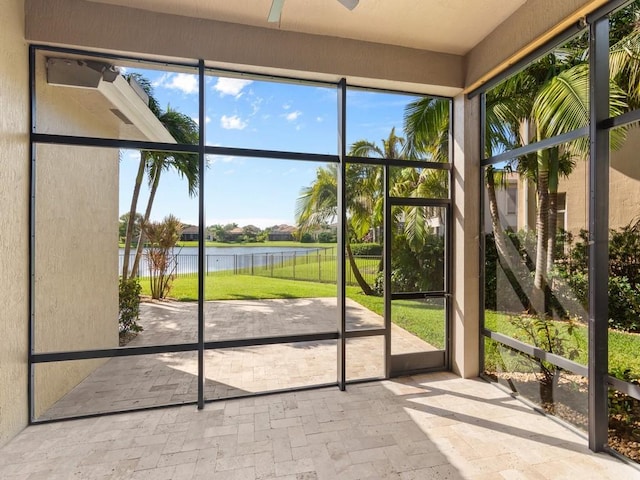 1745 Belmont Cir SW, Vero Beach, FL 32968 - unfurnished sunroom featuring a water view and a ceiling fan