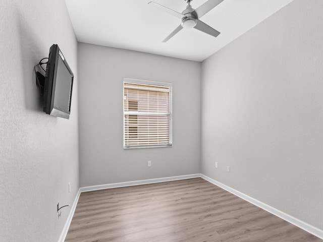 unfurnished room with ceiling fan and light hardwood / wood-style floors