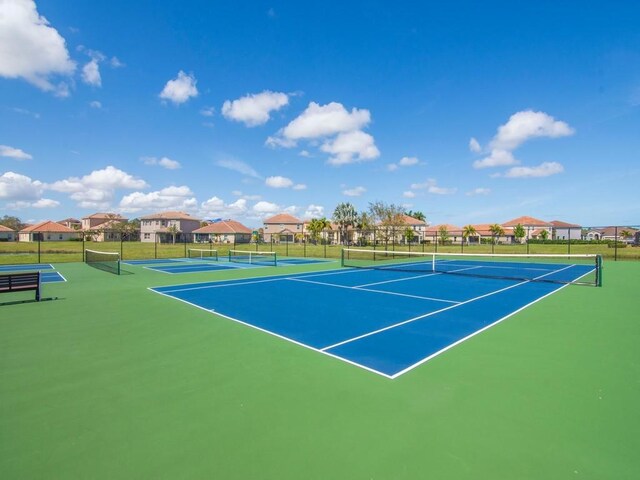 1745 Belmont Cir SW, Vero Beach, FL 32968 - view of tennis court with a residential view