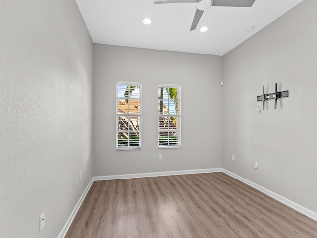 empty room with light wood-type flooring and ceiling fan