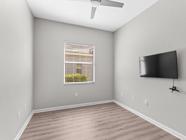 1745 Belmont Cir SW, Vero Beach, FL 32968 - empty room with light wood finished floors and ceiling fan