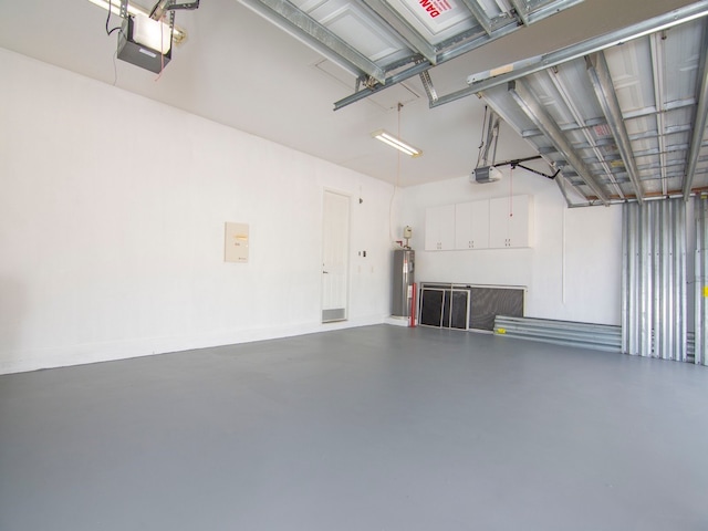 garage featuring water heater and a garage door opener