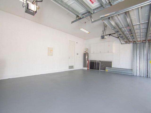 1745 Belmont Cir SW, Vero Beach, FL 32968 - garage with a garage door opener and water heater