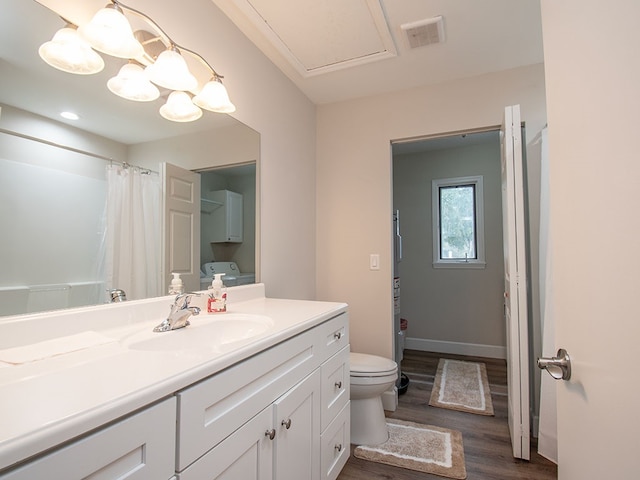 bathroom with a shower with shower curtain, vanity, hardwood / wood-style flooring, and toilet