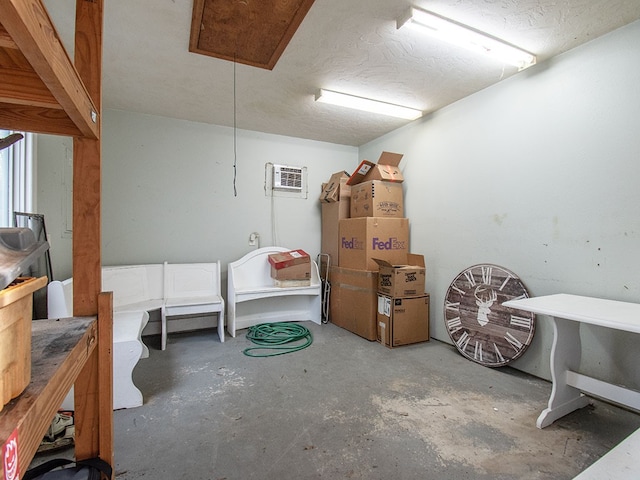 basement featuring an AC wall unit