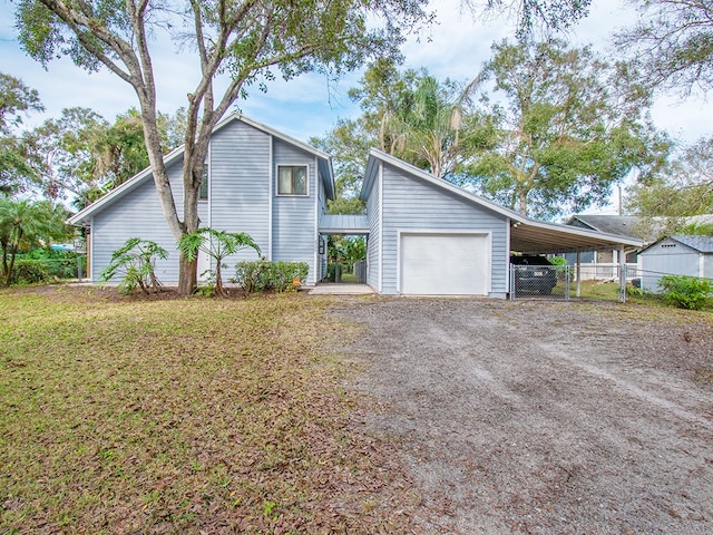 view of front of house featuring a carport and a garage