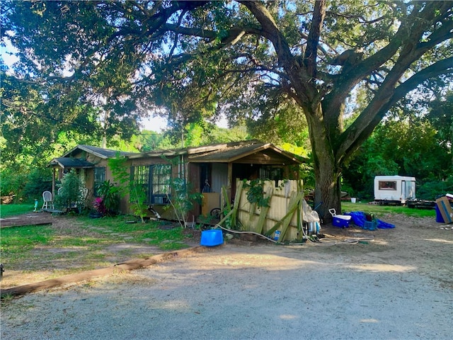 view of front of house featuring a storage shed