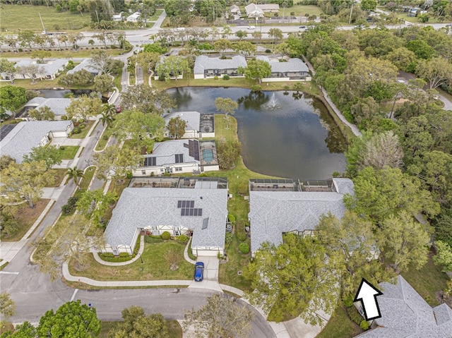 drone / aerial view with a water view and a residential view