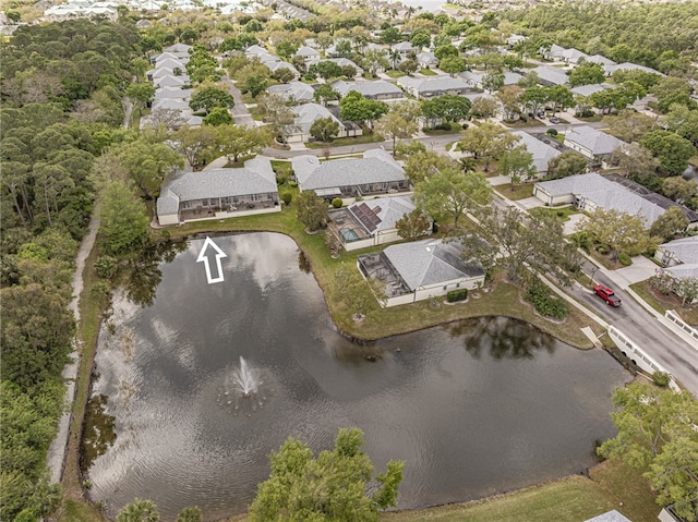 drone / aerial view featuring a water view and a residential view