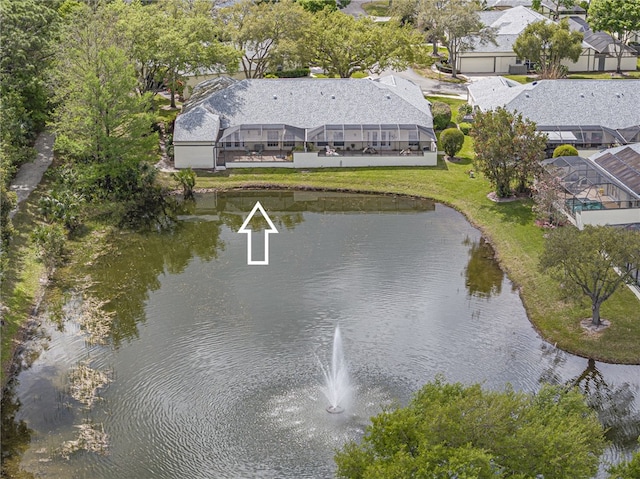 drone / aerial view with a residential view and a water view