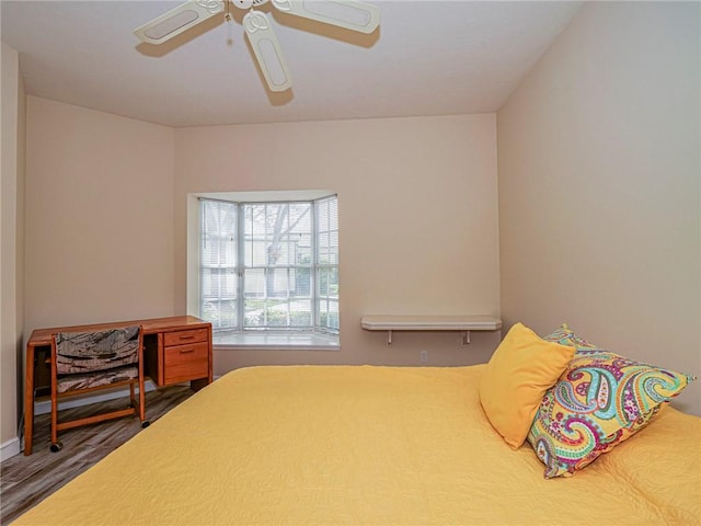 bedroom with ceiling fan and wood finished floors