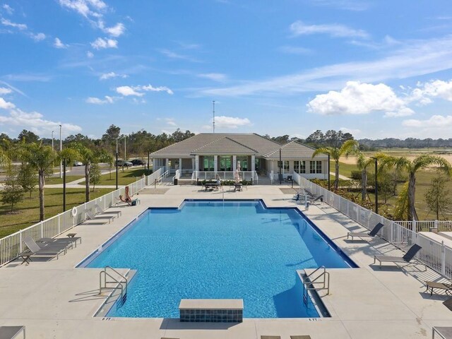 4385 Lago Cir, Vero Beach, FL 32967 - community pool with a patio area and fence