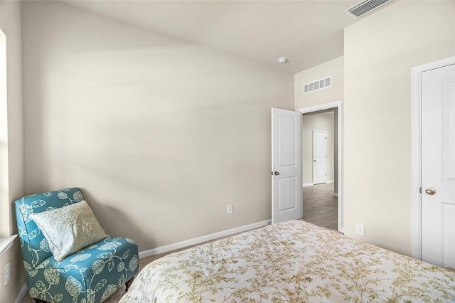 4385 Lago Cir, Vero Beach, FL 32967 - carpeted bedroom featuring vaulted ceiling and baseboards
