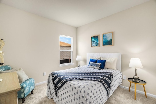 bedroom with carpet floors and baseboards