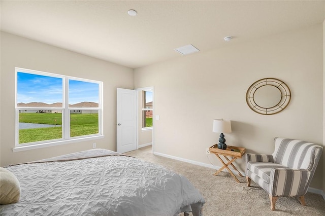 bedroom with carpet floors and baseboards