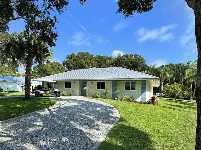 single story home with a front yard