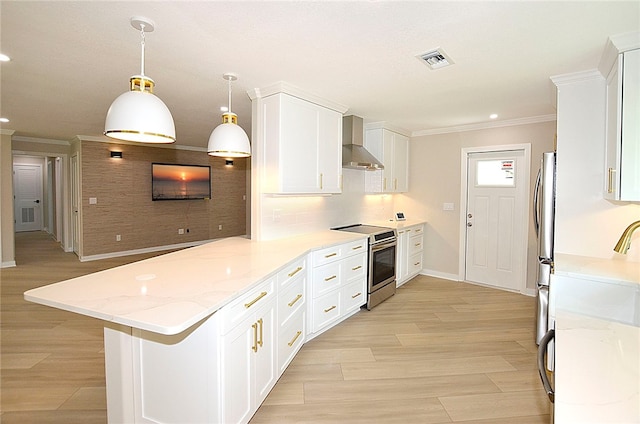 kitchen featuring kitchen peninsula, wall chimney exhaust hood, pendant lighting, and stainless steel electric range