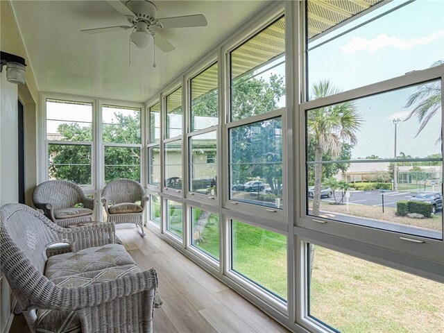 sunroom / solarium with ceiling fan
