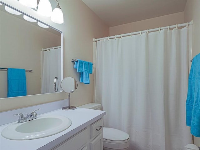 full bathroom featuring toilet and vanity