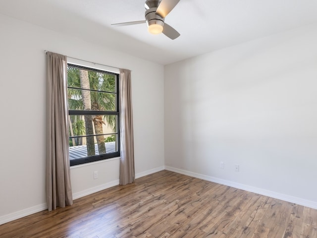 spare room with ceiling fan and light hardwood / wood-style floors