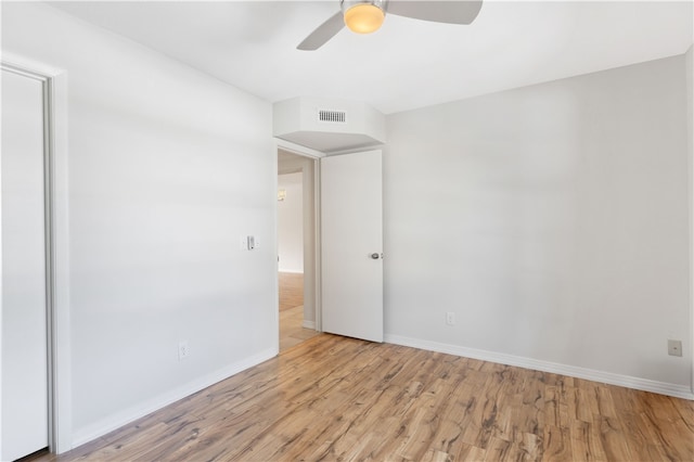 unfurnished room with ceiling fan and light hardwood / wood-style flooring