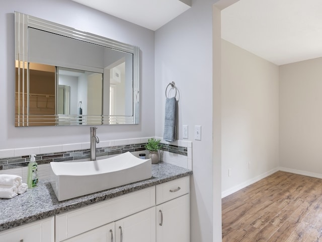 bathroom featuring hardwood / wood-style floors and vanity