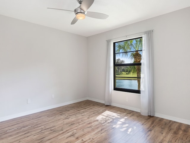 spare room with ceiling fan and light hardwood / wood-style flooring