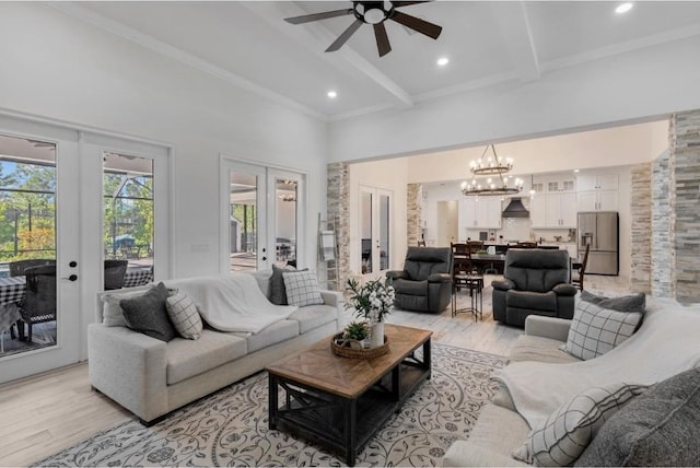 living room featuring french doors, crown molding, light hardwood / wood-style floors, and beamed ceiling