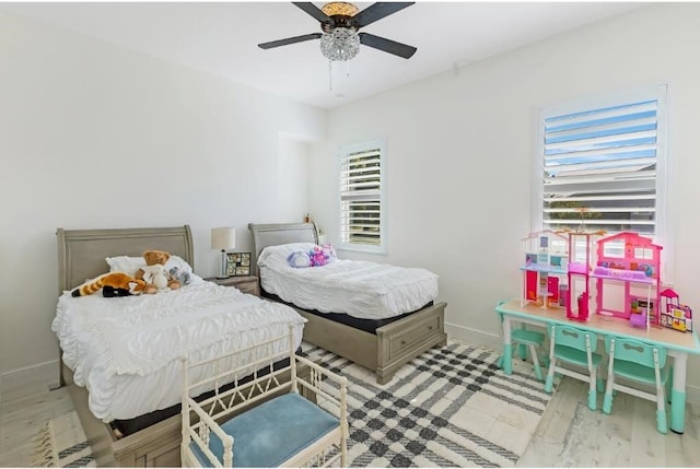 bedroom featuring ceiling fan and light hardwood / wood-style flooring