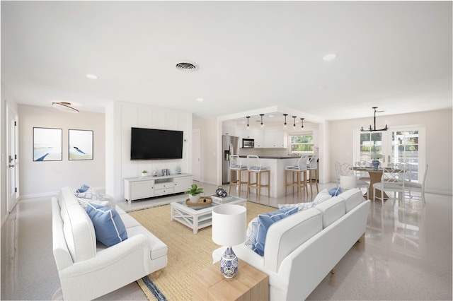 living room with an inviting chandelier