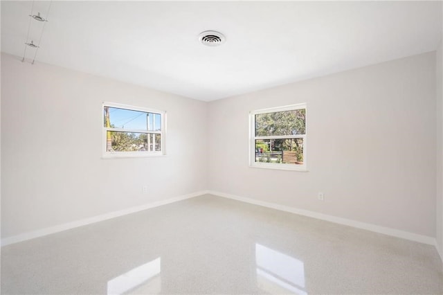 unfurnished room with a wealth of natural light